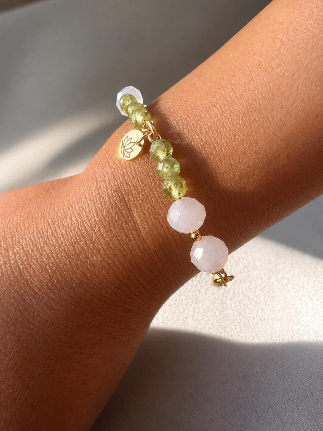 A Born From Water bracelet worn on the wrist